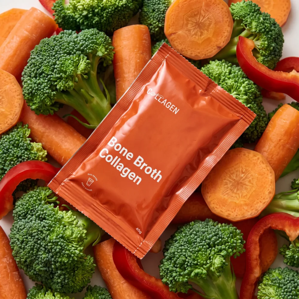 Vegetable soup flavour collagen sachets alongside three Collagen UAE boxes